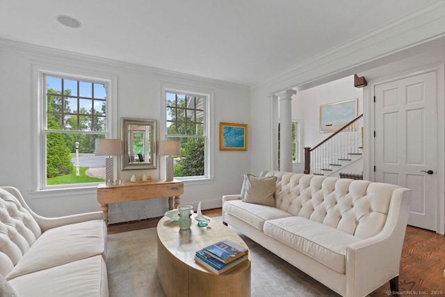 206 Fox Hopyard Rd, East Haddam, CT 06423 - living room with wood finished floors, ornamental molding, stairway, and ornate columns