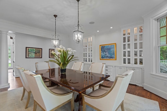206 Fox Hopyard Rd, East Haddam, CT 06423 - dining area with wood finished floors, healthy amount of natural light, crown molding, a chandelier, and ornate columns