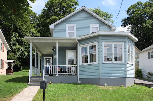 58 Litchfield St, Thomaston, CT 06787 - view of front facade featuring a porch and a front lawn