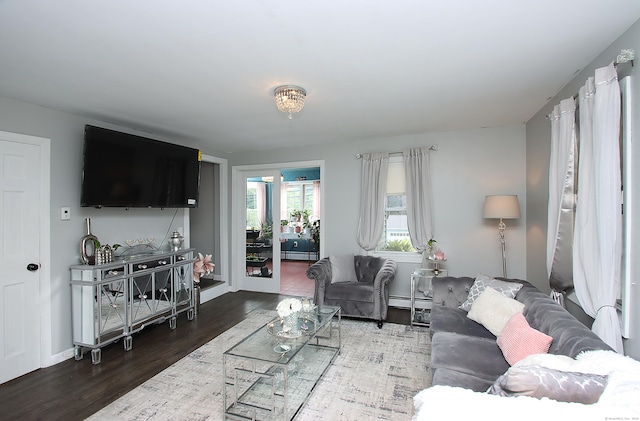 58 Litchfield St, Thomaston, CT 06787 - living area featuring a baseboard heating unit and wood finished floors