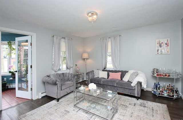 58 Litchfield St, Thomaston, CT 06787 - living room with wood finished floors, a baseboard heating unit, and plenty of natural light