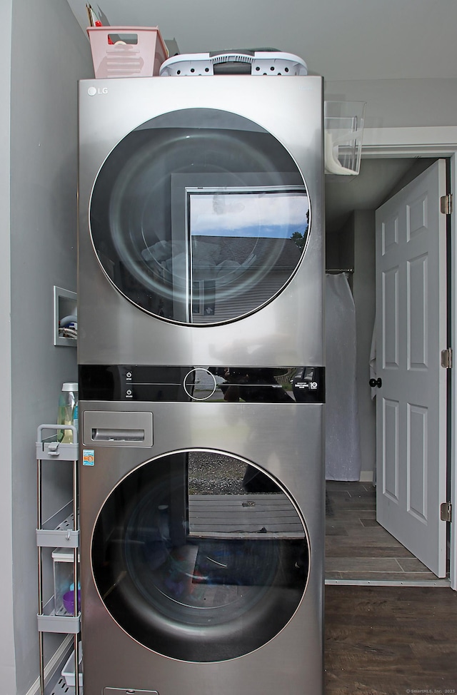 58 Litchfield St, Thomaston, CT 06787 - laundry room featuring stacked washer / drying machine and wood finished floors