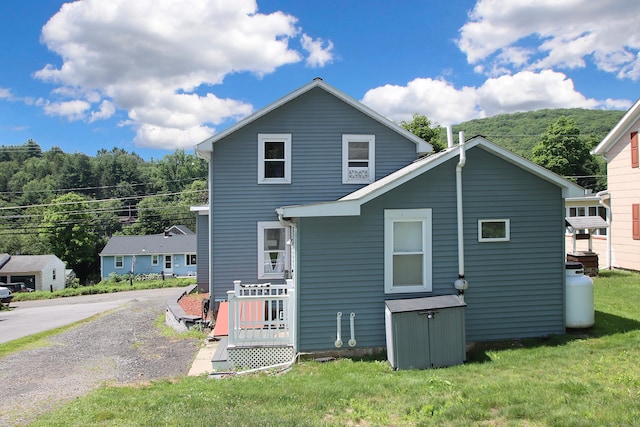 58 Litchfield St, Thomaston, CT 06787 - rear view of house with a yard
