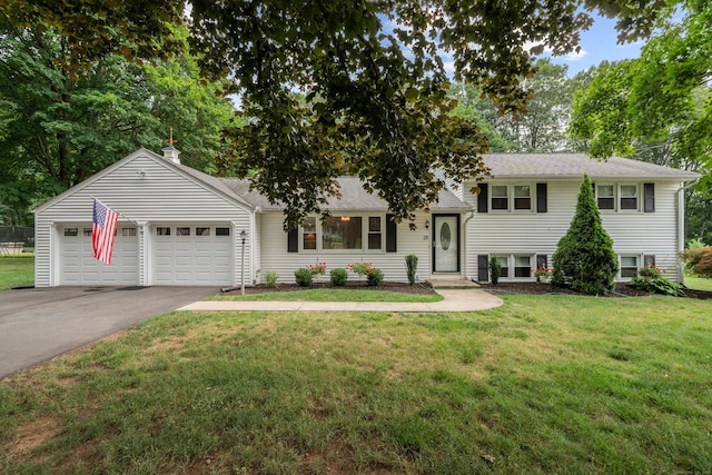 29 Jeffrey Dr, Wallingford, CT 06492 - tri-level home with driveway, a garage, a front yard, and a shingled roof