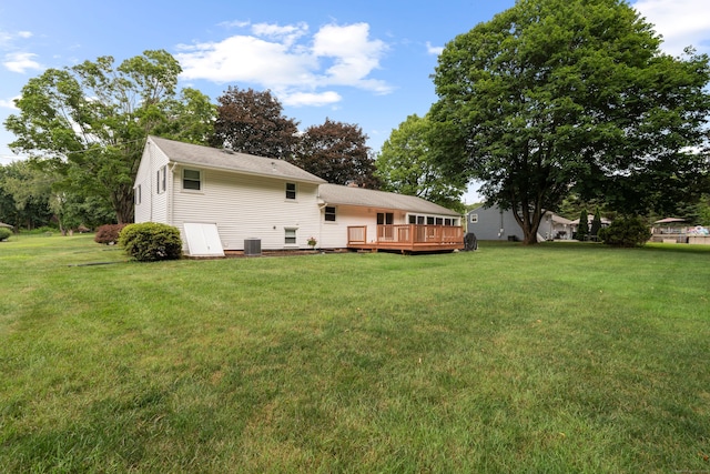 29 Jeffrey Dr, Wallingford, CT 06492 - back of property with a wooden deck and a lawn