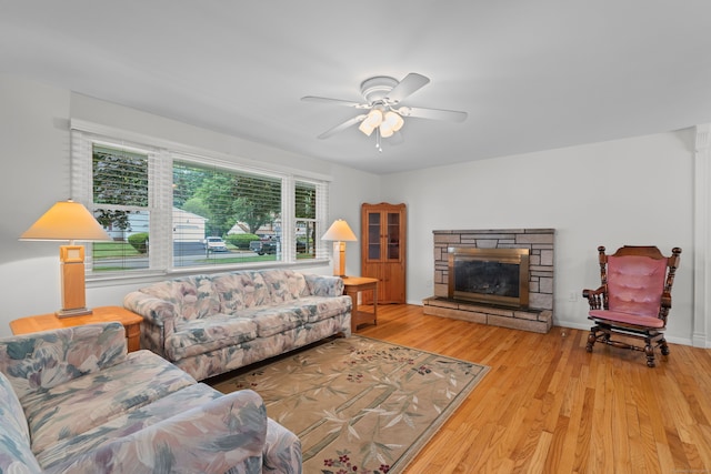29 Jeffrey Dr, Wallingford, CT 06492 - living room featuring wood finished floors, a stone fireplace, and ceiling fan
