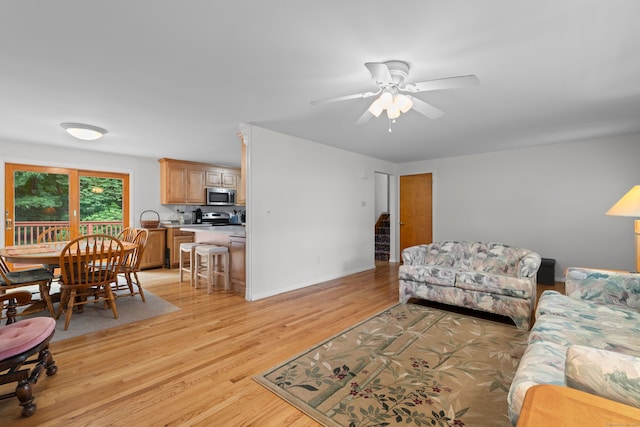 29 Jeffrey Dr, Wallingford, CT 06492 - living room featuring ceiling fan, light wood-style floors, and stairway