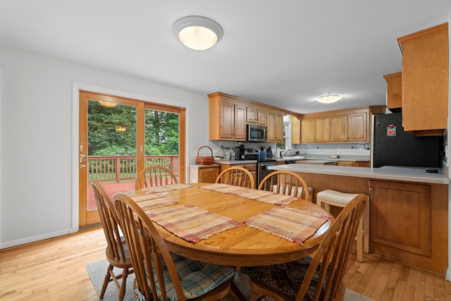 29 Jeffrey Dr, Wallingford, CT 06492 - dining room with light wood-style flooring and baseboards