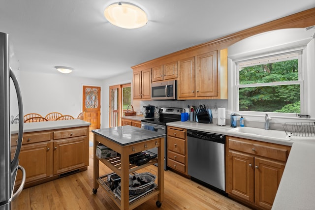 29 Jeffrey Dr, Wallingford, CT 06492 - kitchen featuring stainless steel appliances, light countertops, plenty of natural light, and light wood-type flooring