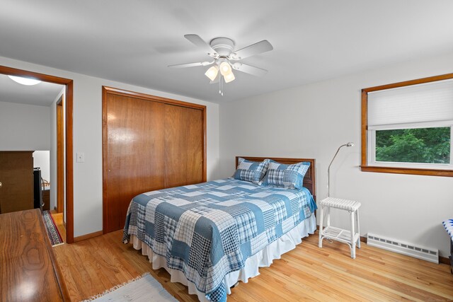 29 Jeffrey Dr, Wallingford, CT 06492 - bedroom with baseboard heating, a closet, wood finished floors, and ceiling fan