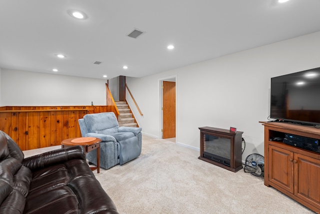 29 Jeffrey Dr, Wallingford, CT 06492 - living area featuring stairway, light colored carpet, recessed lighting, a dry bar, and a glass covered fireplace