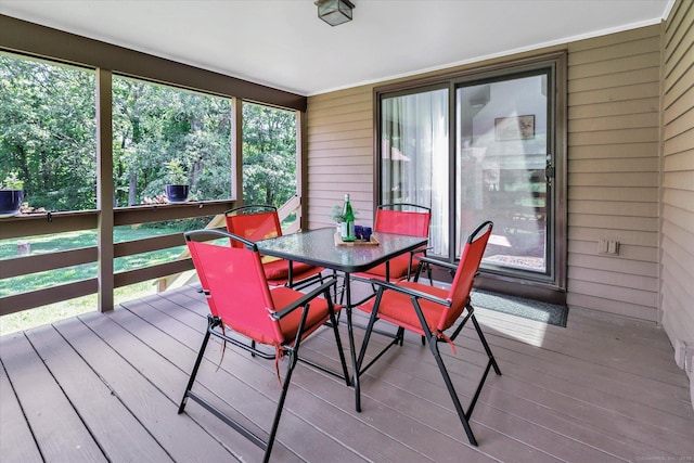 16 Juniper Cir Unit 16, Monroe, CT 06468 - sunroom featuring wood walls, hardwood / wood-style flooring, outdoor dining space, and a wooden deck