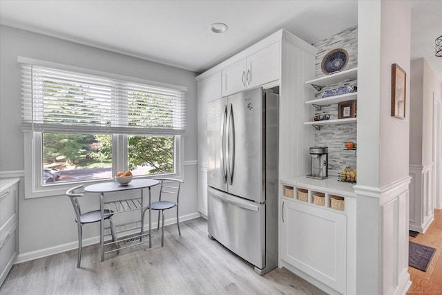 16 Juniper Cir Unit 16, Monroe, CT 06468 - kitchen with freestanding refrigerator, white cabinets, light wood-style flooring, light countertops, and open shelves