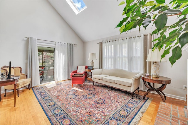 16 Juniper Cir Unit 16, Monroe, CT 06468 - living room featuring high vaulted ceiling, a skylight, and wood finished floors
