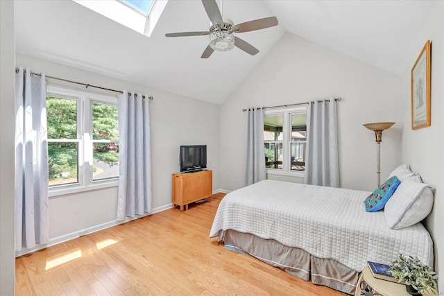 16 Juniper Cir Unit 16, Monroe, CT 06468 - bedroom featuring multiple windows, wood finished floors, a skylight, high vaulted ceiling, and a ceiling fan