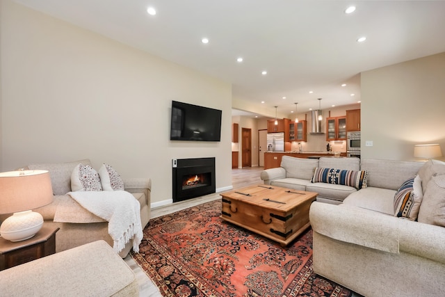 39 Beebe Rd, East Haddam, CT 06423 - living area with recessed lighting, light wood-type flooring, and a warm lit fireplace