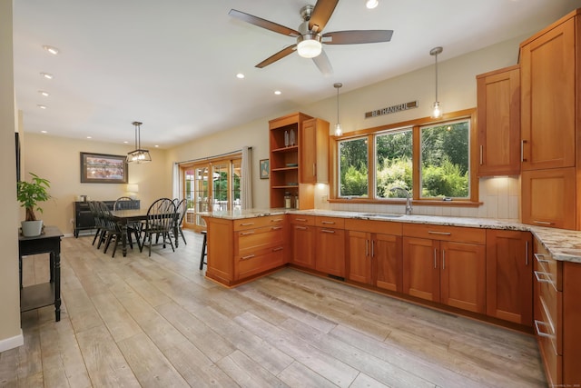 39 Beebe Rd, East Haddam, CT 06423 - kitchen featuring brown cabinets, ceiling fan, light stone countertops, a peninsula, and recessed lighting