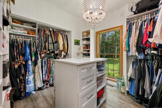 39 Beebe Rd, East Haddam, CT 06423 - spacious closet featuring light wood-style flooring and a chandelier