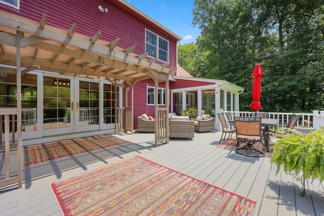 39 Beebe Rd, East Haddam, CT 06423 - wooden deck with a pergola, outdoor dining space, an outdoor hangout area, french doors, and a sunroom
