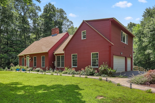 39 Beebe Rd, East Haddam, CT 06423 - view of front of house featuring an attached garage, a chimney, a front lawn, roof with shingles, and driveway