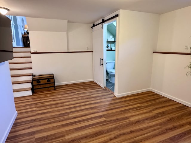 44 Coolidge St, Windsor Locks, CT 06096 - unfurnished room featuring wood finished floors and a barn door