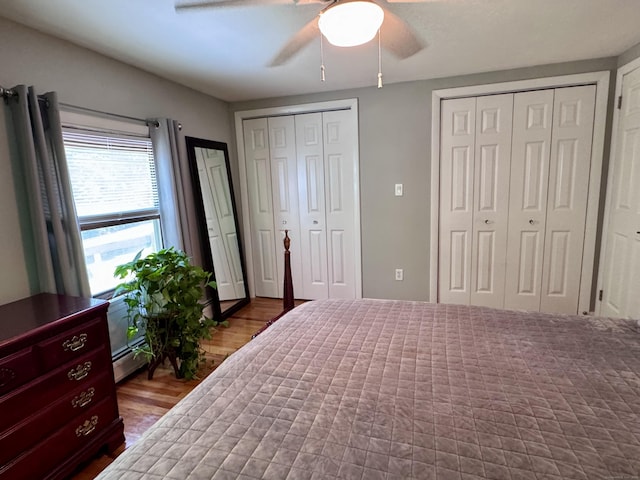 44 Coolidge St, Windsor Locks, CT 06096 - bedroom featuring wood finished floors, two closets, baseboard heating, and ceiling fan