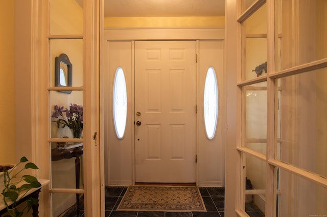 23 E St, Stafford, CT 06076 - foyer with dark tile patterned floors