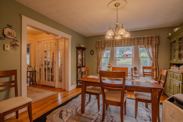 23 E St, Stafford, CT 06076 - dining area with wood finished floors and a chandelier