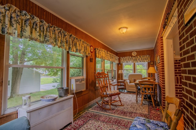 23 E St, Stafford, CT 06076 - sunroom with ornamental molding, cooling unit, and wood walls