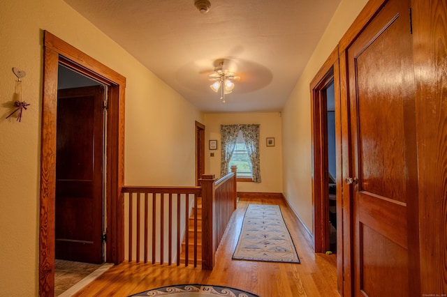 23 E St, Stafford, CT 06076 - hallway featuring wood finished floors and an upstairs landing