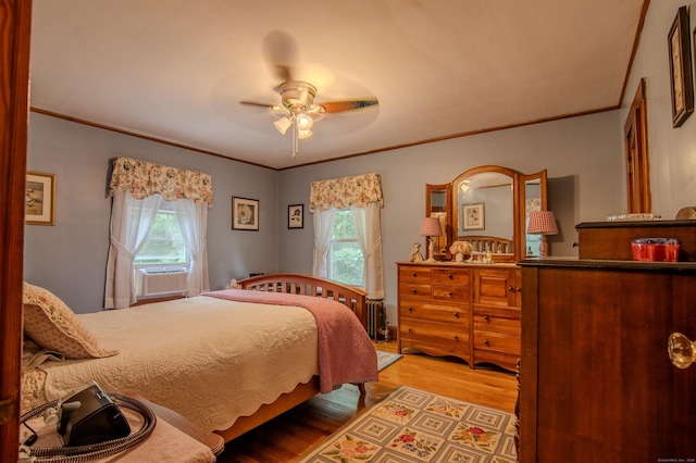 23 E St, Stafford, CT 06076 - bedroom with multiple windows, light wood-style floors, cooling unit, crown molding, and ceiling fan