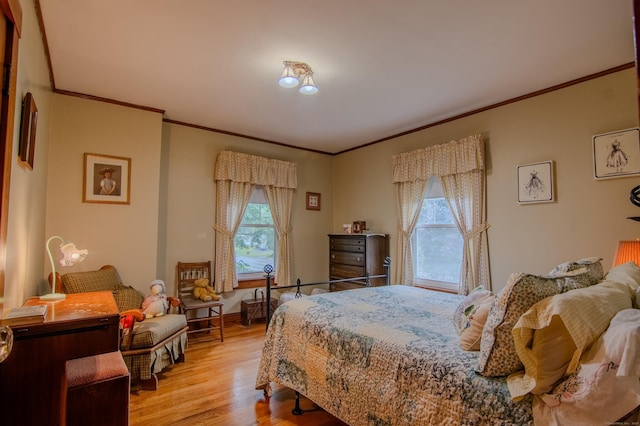 23 E St, Stafford, CT 06076 - bedroom with crown molding and light wood-style flooring