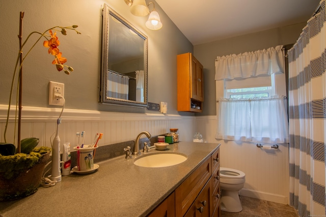 23 E St, Stafford, CT 06076 - bathroom with vanity, wainscoting, tile patterned flooring, and curtained shower
