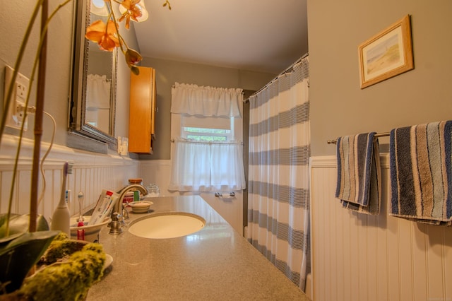 23 E St, Stafford, CT 06076 - full bathroom with wainscoting, a shower with curtain, and vanity