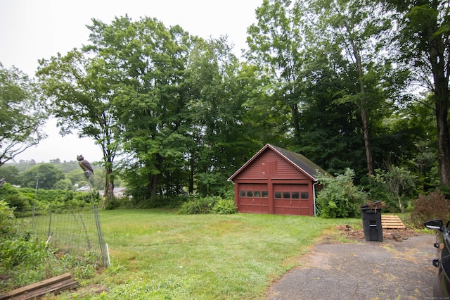 23 E St, Stafford, CT 06076 - view of grassy yard with an outbuilding and a garage