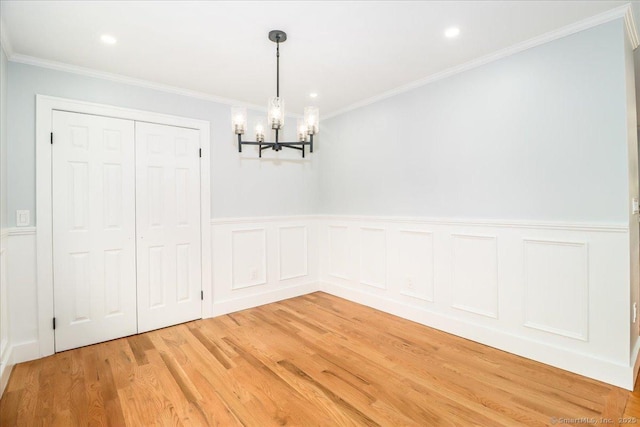 12 Deer Run Rd, Brookfield, CT 06804 - unfurnished dining area with a chandelier, light wood finished floors, crown molding, a wainscoted wall, and recessed lighting