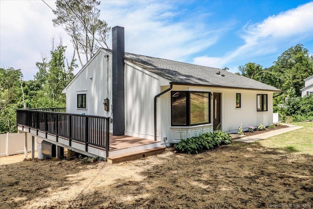 12 Deer Run Rd, Brookfield, CT 06804 - rear view of house with a chimney, a wooden deck, and a shingled roof