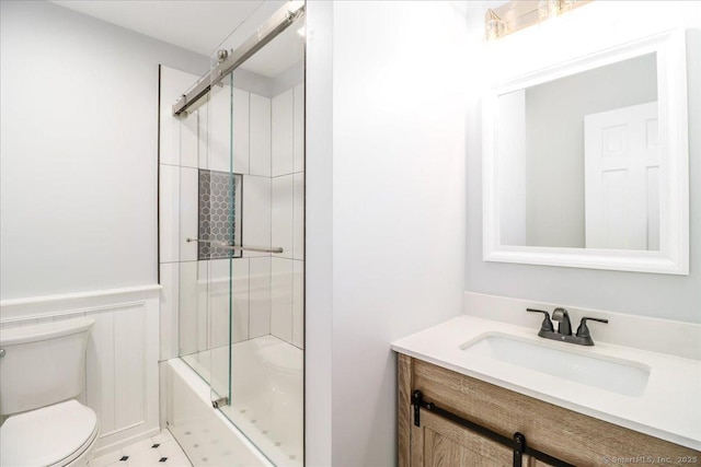 12 Deer Run Rd, Brookfield, CT 06804 - full bathroom featuring vanity, shower / bath combination with glass door, and wainscoting