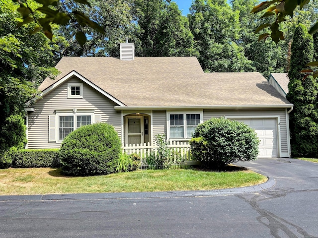 2 Apple Blossom Ln, East Lyme, CT 06357 - view of front of home with a chimney, a garage, driveway, and a shingled roof