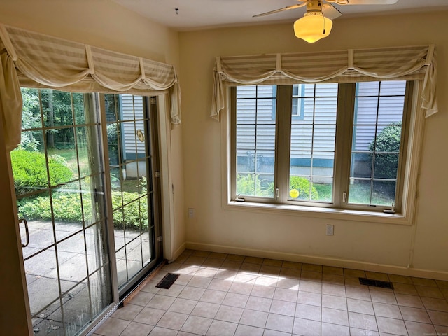 2 Apple Blossom Ln, East Lyme, CT 06357 - unfurnished dining area with light tile patterned floors and a ceiling fan