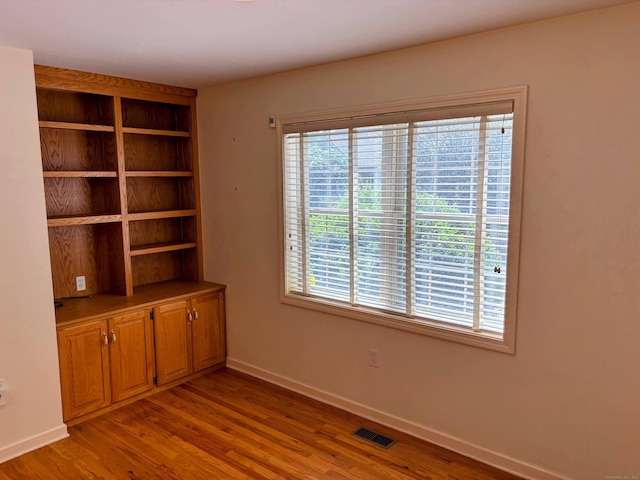 2 Apple Blossom Ln, East Lyme, CT 06357 - spare room featuring wood finished floors and baseboards
