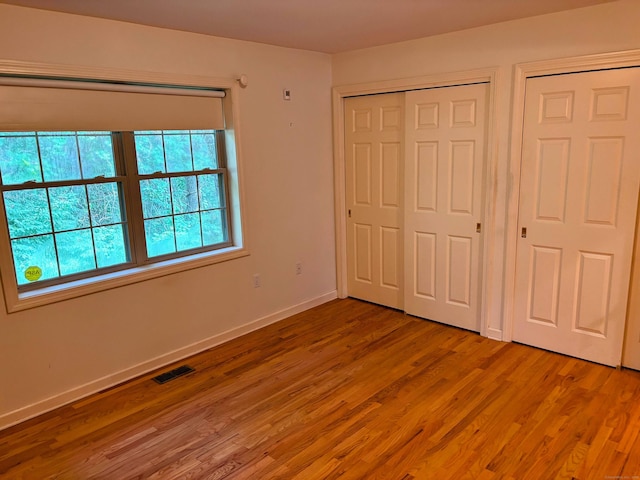 2 Apple Blossom Ln, East Lyme, CT 06357 - unfurnished bedroom with light wood-style flooring and baseboards