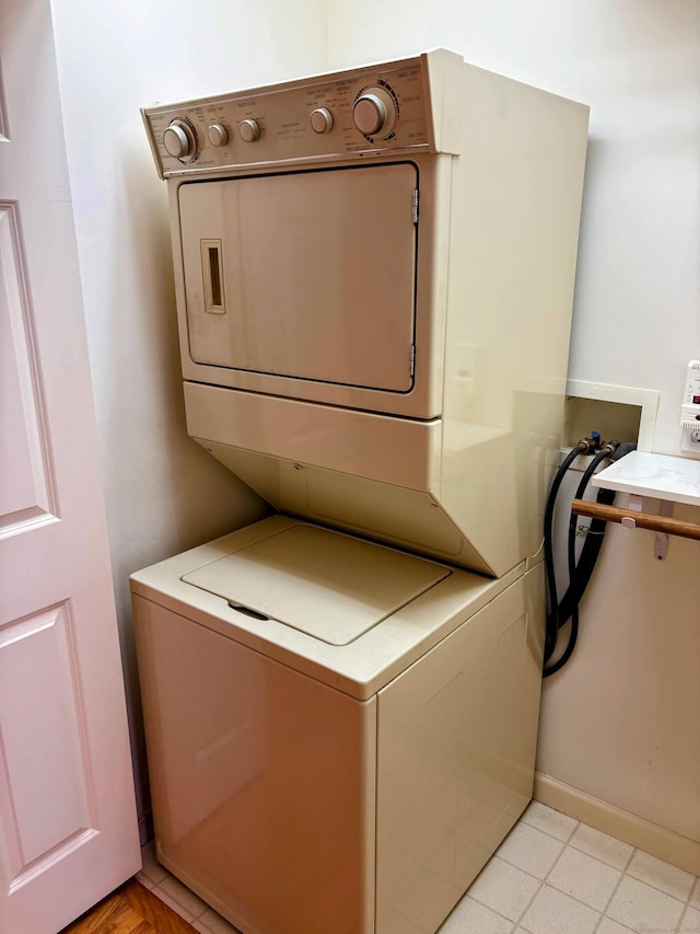 2 Apple Blossom Ln, East Lyme, CT 06357 - washroom featuring stacked washing machine and dryer and baseboards