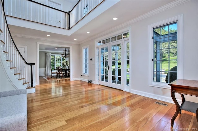 30 Soundview Farm Rd, Weston, CT 06883 - foyer with hardwood / wood-style floors, stairway, ornamental molding, and recessed lighting