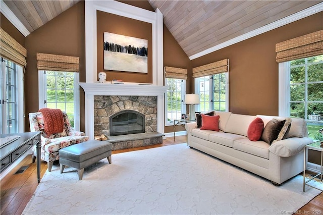 30 Soundview Farm Rd, Weston, CT 06883 - living room with wood ceiling, lofted ceiling, wood finished floors, healthy amount of natural light, and a stone fireplace