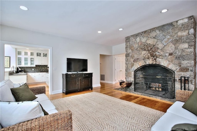 30 Soundview Farm Rd, Weston, CT 06883 - living area with light wood-style floors, recessed lighting, and a fireplace