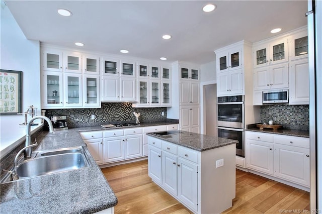30 Soundview Farm Rd, Weston, CT 06883 - kitchen featuring stainless steel appliances, a center island, white cabinetry, backsplash, and recessed lighting