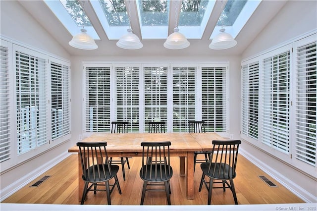 30 Soundview Farm Rd, Weston, CT 06883 - dining area featuring a skylight, vaulted ceiling, and light wood-type flooring