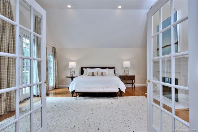 30 Soundview Farm Rd, Weston, CT 06883 - bedroom with lofted ceiling, wood finished floors, recessed lighting, and french doors