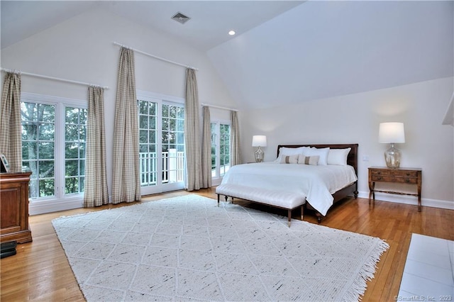 30 Soundview Farm Rd, Weston, CT 06883 - bedroom with high vaulted ceiling, light wood finished floors, and access to exterior